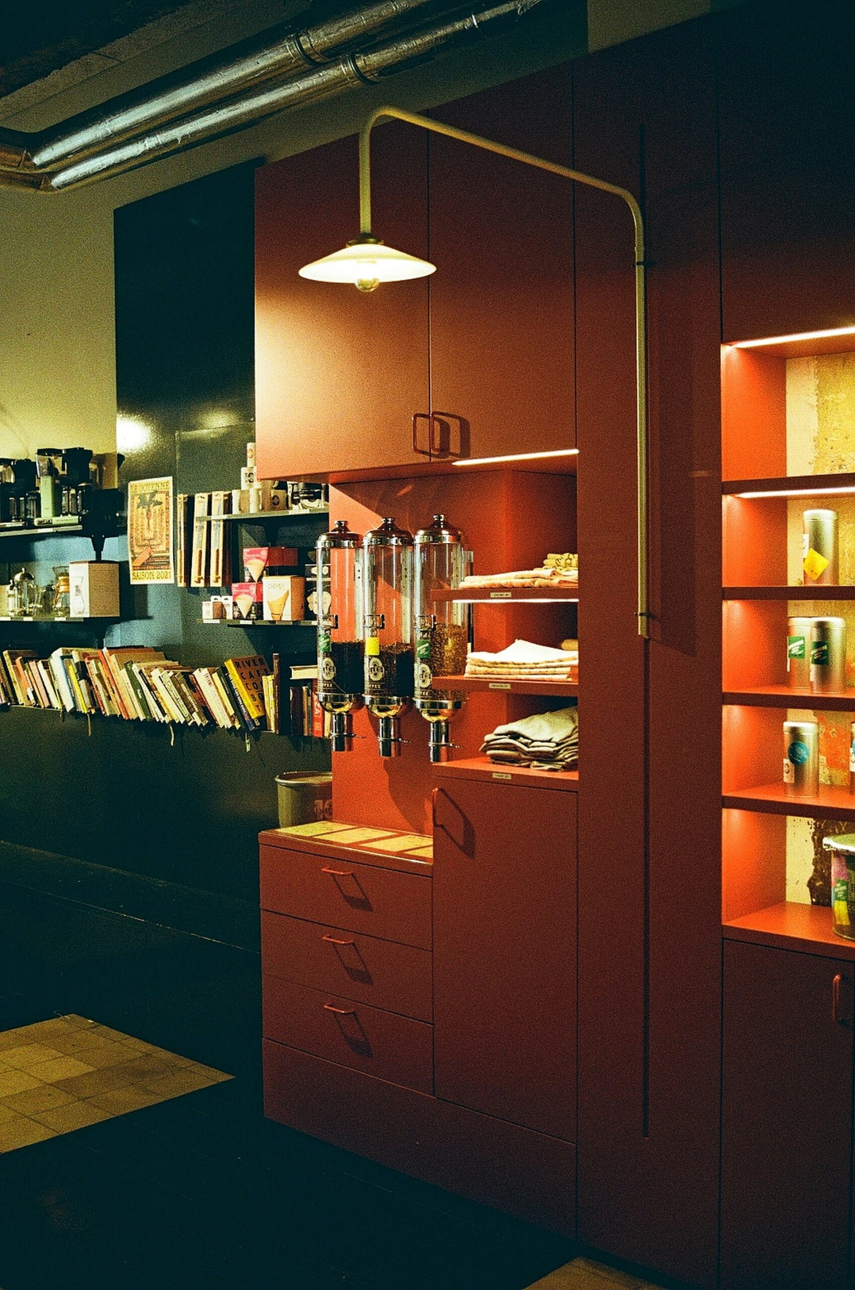 room divider bookcase in studio with colorful rug and hidden storage