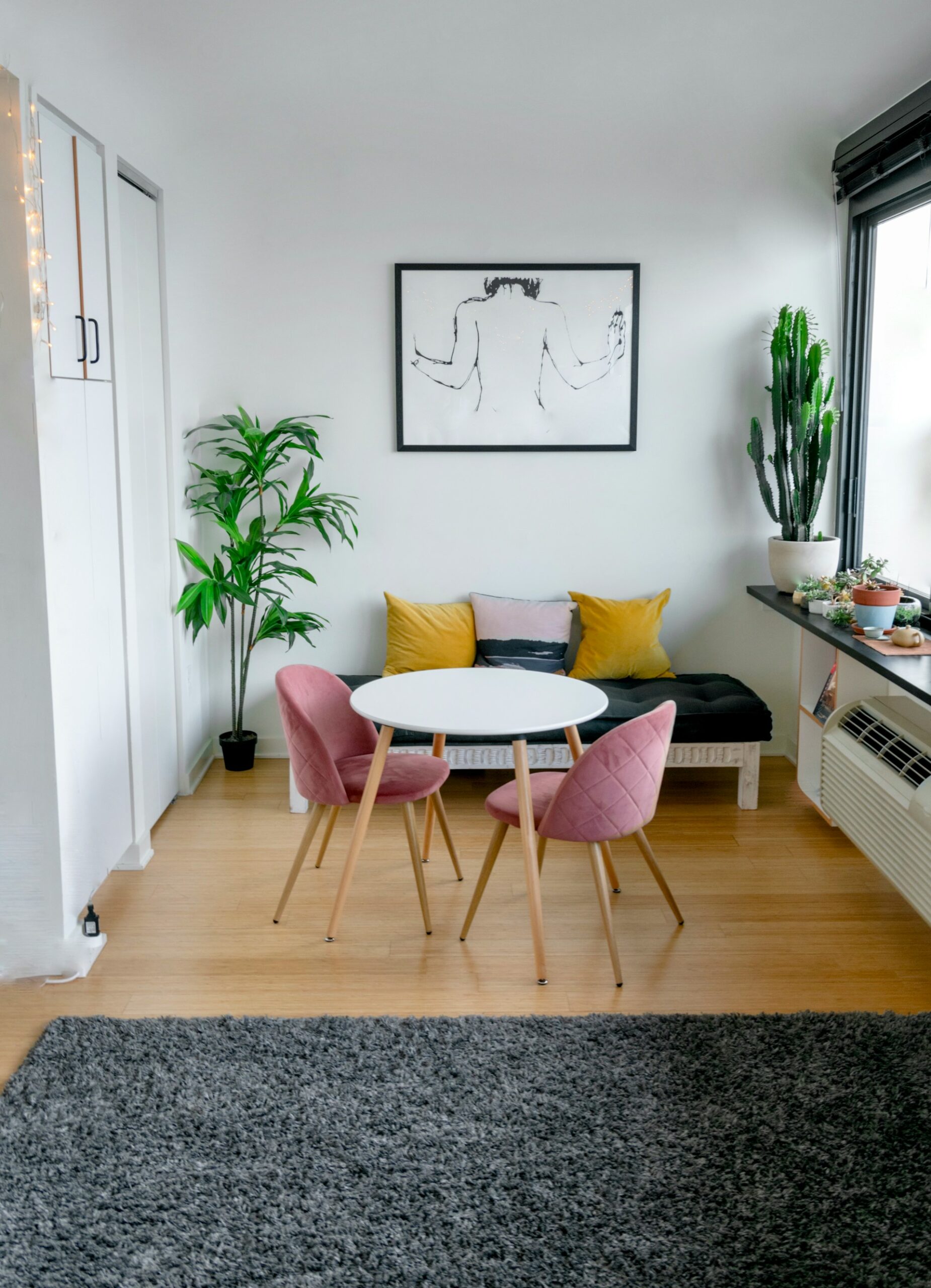 studio apartment with midcentury modern furniture and warm tones